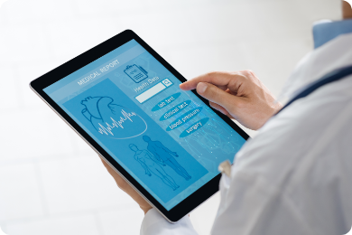 A healthcare professional analyzes a patient's medical information, including organ health icons and vital statistics, on a transparent digital screen, illustrating the use of MedTech for advanced diagnostics.